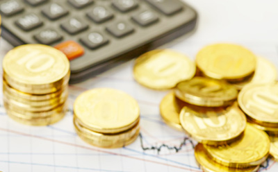 Coins and calculator - growing wealth